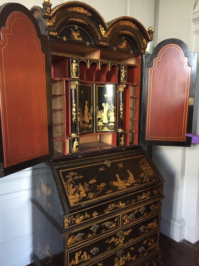 The japanned bureau in situ in the Best Bedchamber at Aston Hall, open to reveal a beautifully decorated red and gold inside.