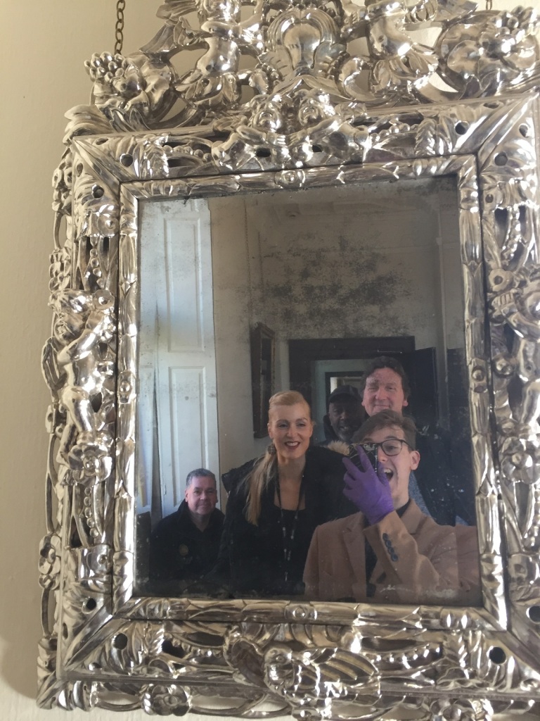 Christopher taking a selfie with the Aston Hall Museum Manager Kimberley and the technicians Ian, Gary, and Carl in a silver mirror in the Orange Chamber at Aston Hall